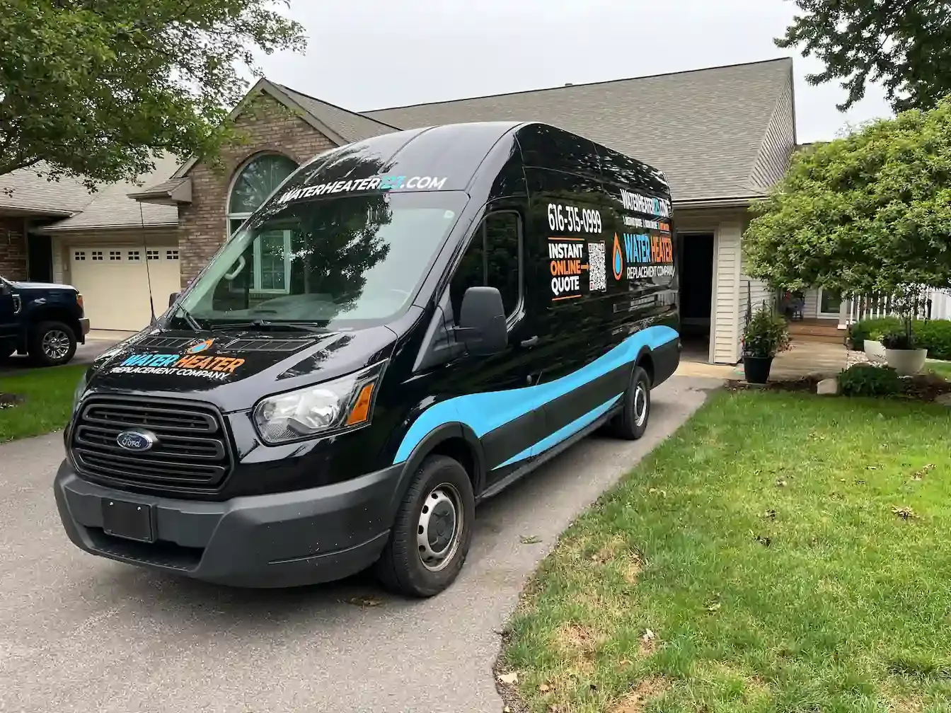 Water Heater Replacement Company technician standing next to service van in Jenison, MI